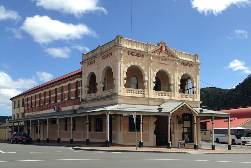 Exterior image of ornate pub on a sunny day. 
