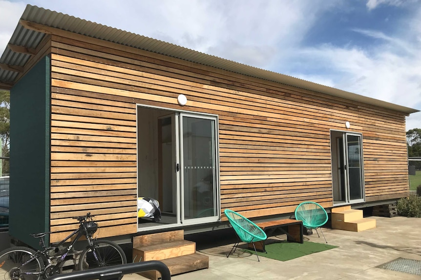 A shipping container converted into a tiny home.