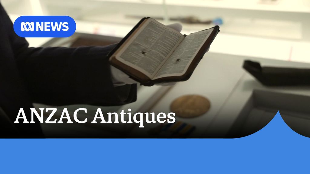 ANZAC Antiques: a gloved hand holds a small bible with a bullet hole 