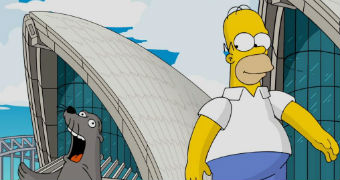 Homer Simpson stands outside the Opera House next to seal