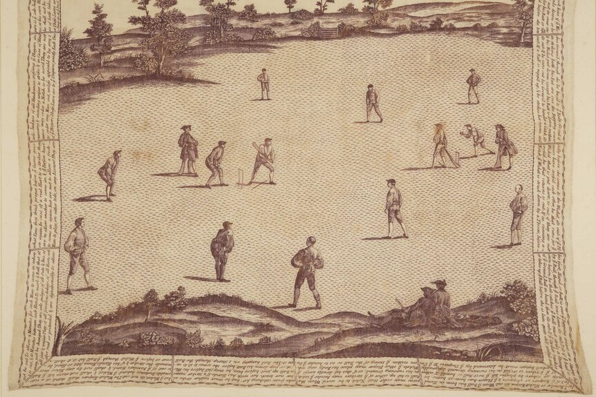 Small writing fills the border of a square silk handkerchief. In the middle, an old-timey game of cricket is being depicted.