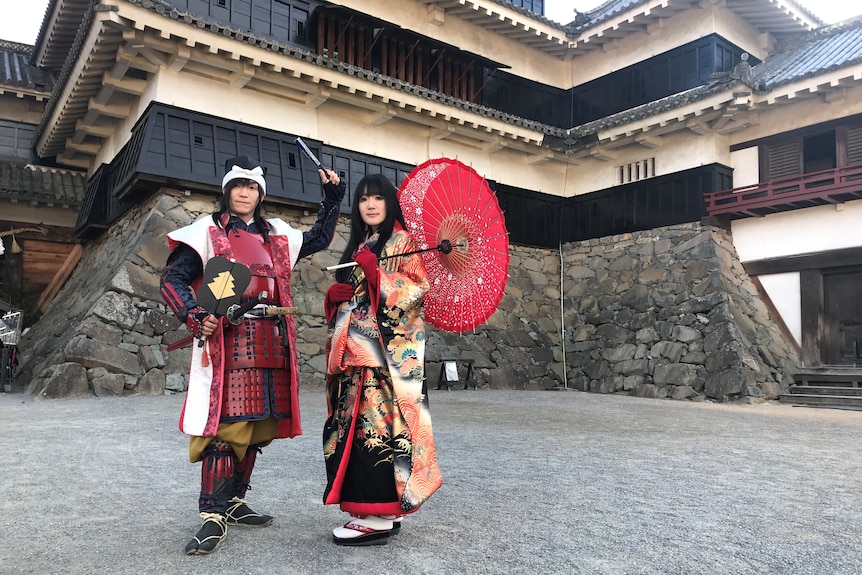 Guides in traditional Japanese dress at Matsumoto Castle