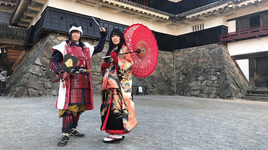 Guides in traditional Japanese dress at Matsumoto Castle