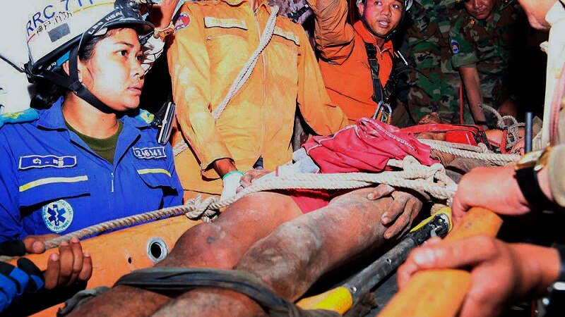 Rescuers carry Sum Bora at Battambang province in north-western of Phnom Penh, Cambodia.