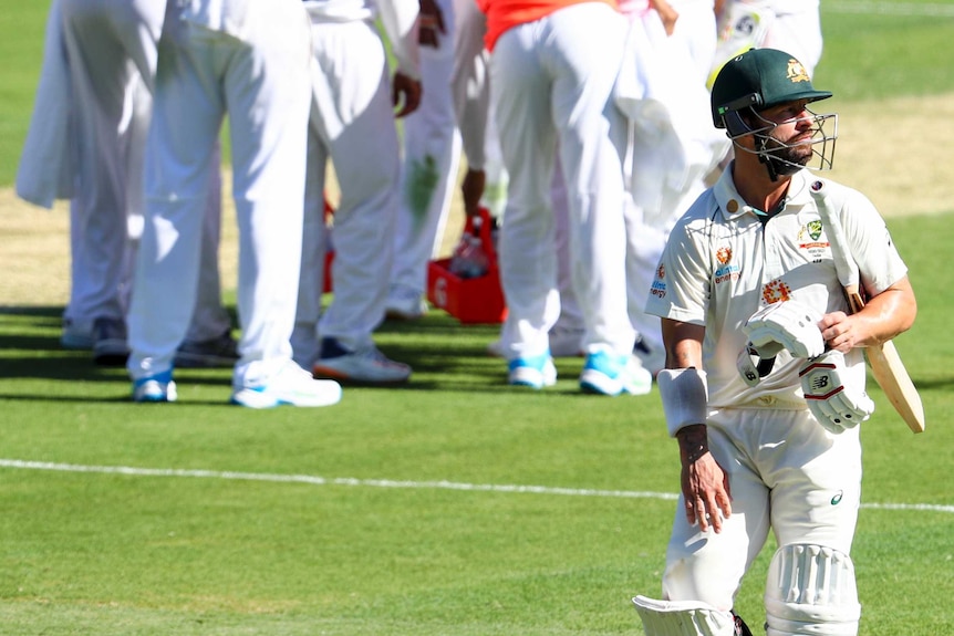 India celebrates as Matthew Wade walks off after his dismissal at the Gabba