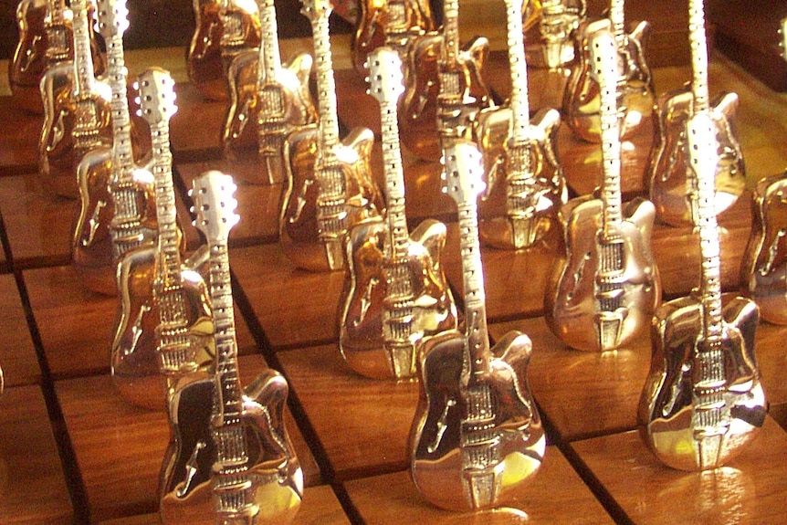 Golden Guitars lined up in rows