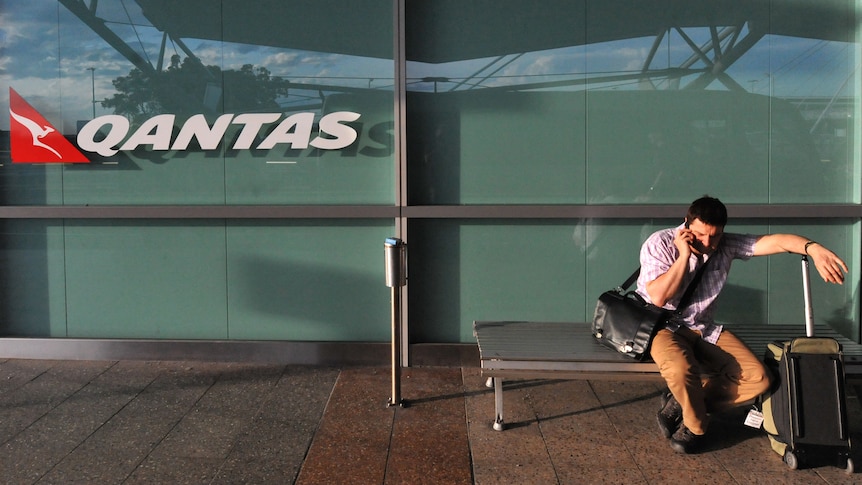 Qantas passenger outside the domestic terminal at Sydney airport
