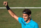 Roger Federer waves to the crowd