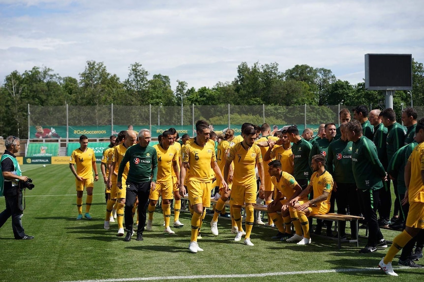 The Socceroos team poses for its official World Cup photo in Russia.