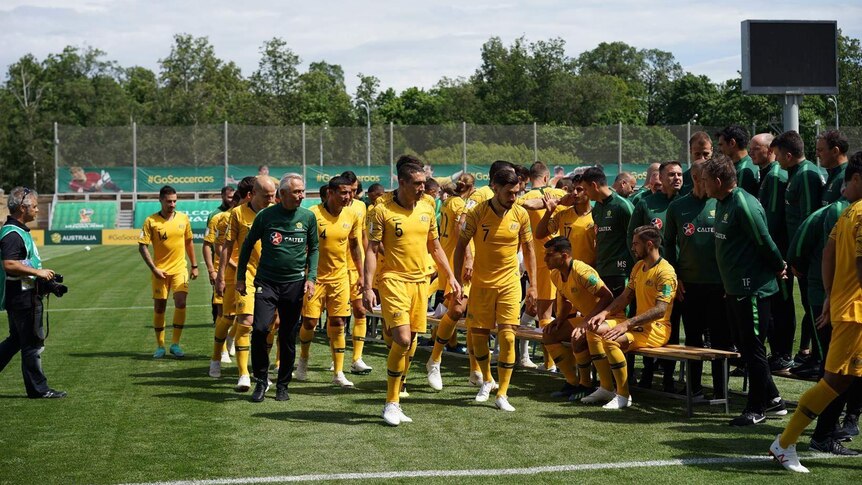 The Socceroos team poses for its official World Cup photo in Russia.