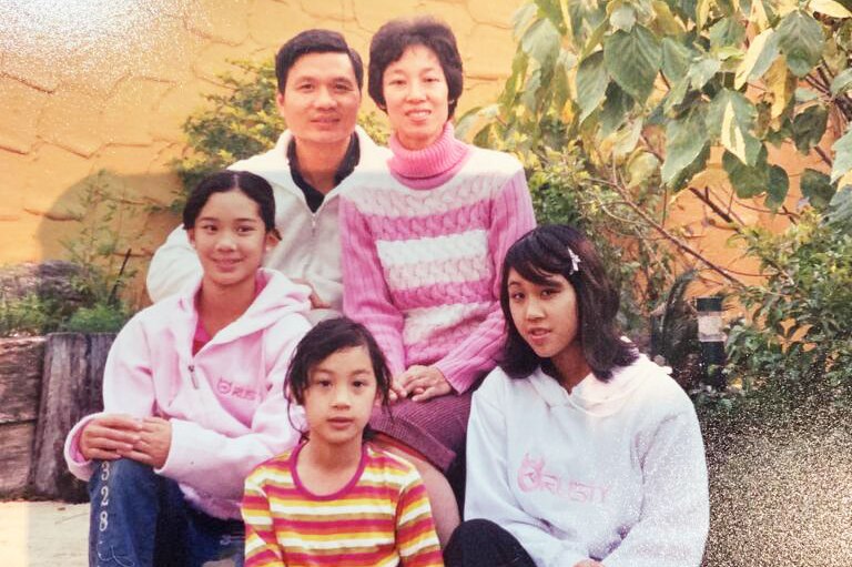 Family photo of Priscilla Hon (centre), with her mum and date, and two siblings.