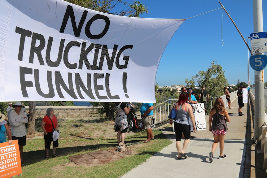 An anti-Roe 8 banner with the words "no trucking funnel" written on it.