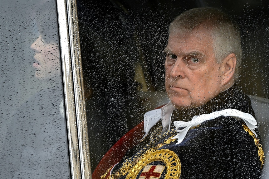 Britain's Prince Andrew leaves Westminster Abbey following the coronation ceremony.