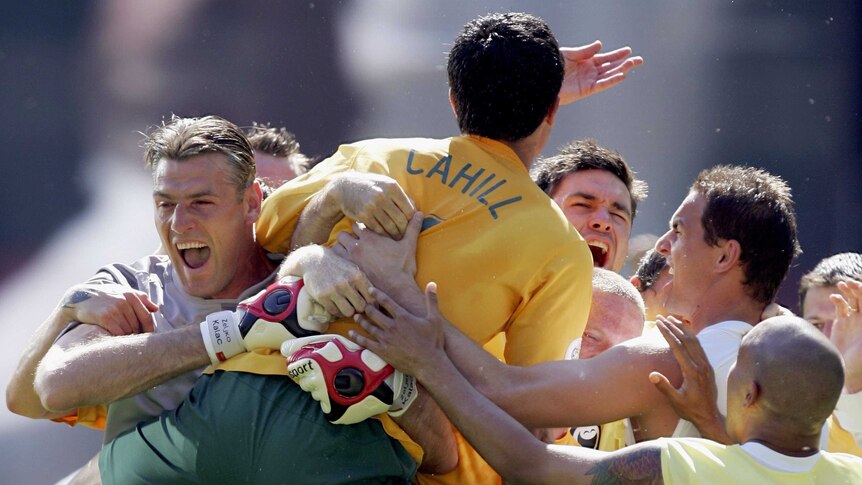 Tim Cahill mobbed by Socceroos team-mates
