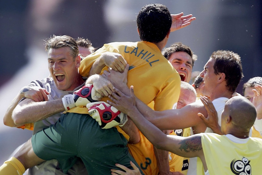 Tim Cahill mobbed by Socceroos team-mates