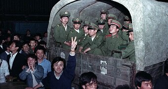 Protesters surround a van of soldiers in May 1989, Beijing, China.