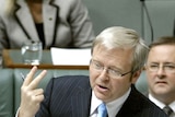 Prime Minister Kevin Rudd holds up two fingers during question time at Parliament House