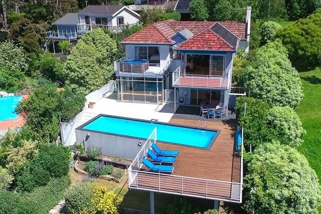 Aerial view of house and pool.