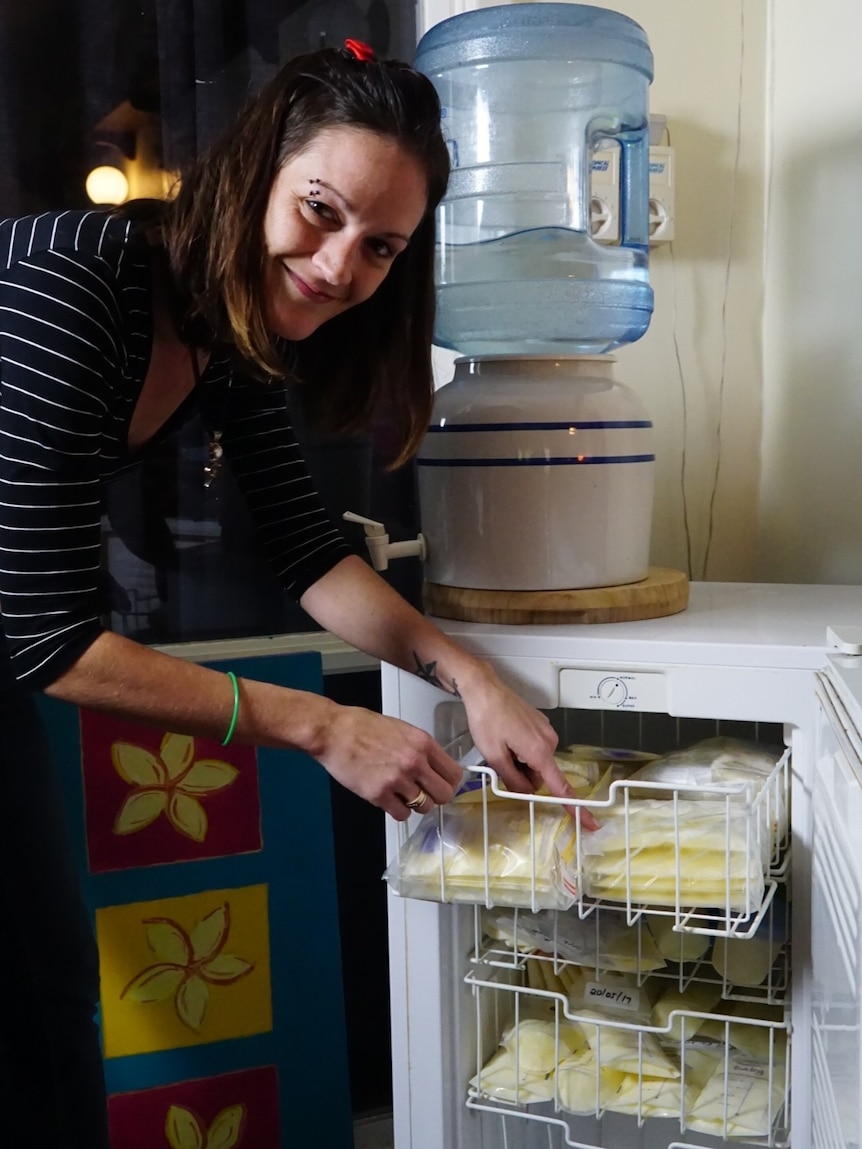 Kayla with some of the donated milk she flew in from Sydney.