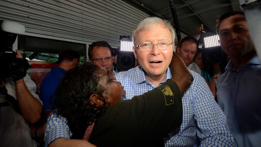 Prime Minister Kevin Rudd receives a hug as he visits Parap Markets in Darwin.