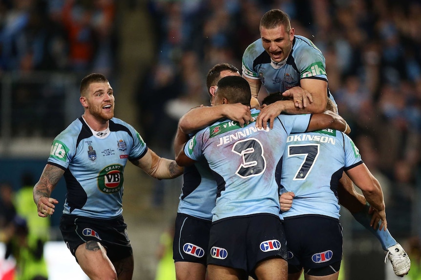 Drought breaker ... The Blues celebrate after Trent Hodkinson scores his try