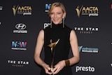 Australian actor Cate Blanchett poses for a photograph after winning the Longford Lyell Award