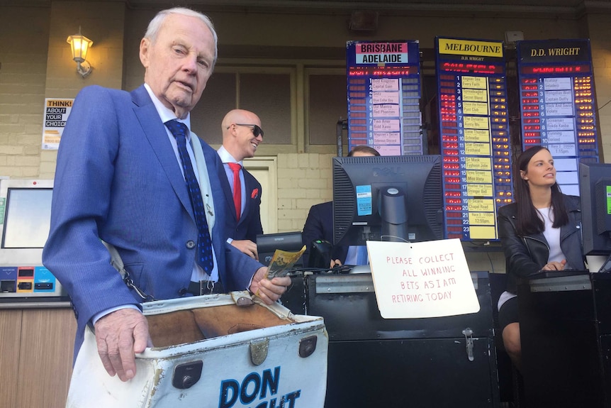 Randwick Racecourse bookmaker Don Wright with his bag