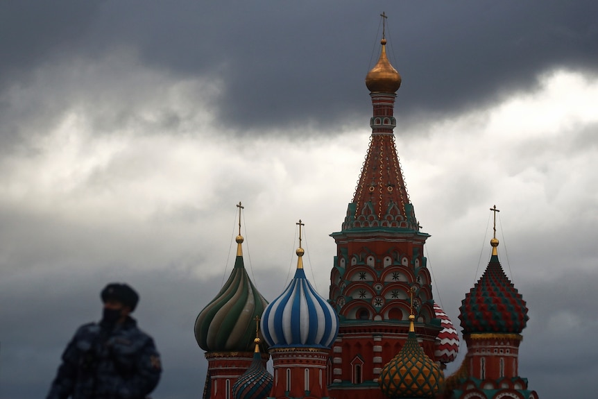 A police officer is seen in front of St Basil's Cathedral in Moscow