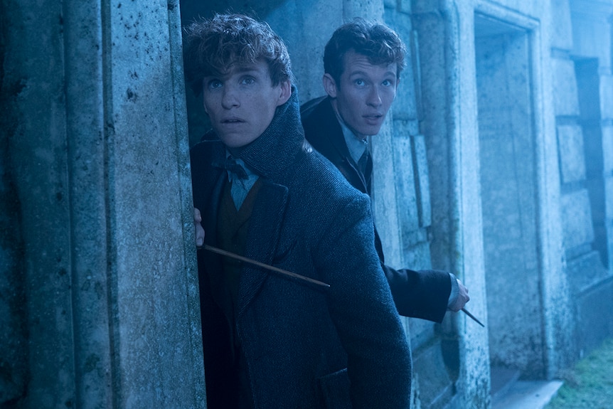 Colour still of Eddie Redmayne and Callum Turner in 2018 film Fantastic Beasts: The Crimes of Grindelwald.