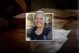 Beverley Roberts smiles at the camera in a photo that is layered over a dark background of paperwork