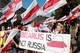 Demonstrators holding sign that reads: Belarus is not Russia, during protests in Minsk.