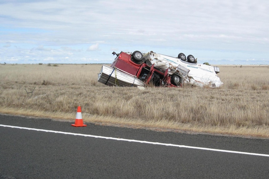 Caravan on top of car after outback crash
