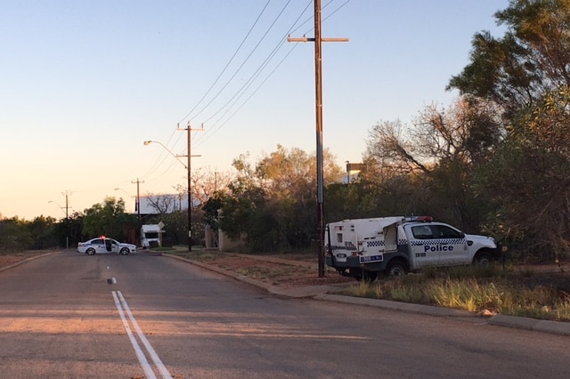 Police cars are parked on Gubinge Road, where an officer shot a man allegedly armed with a knife.