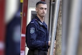 Senior Constable Beau Lamarre-Condon looking sideways the officer is accused of killing two young men