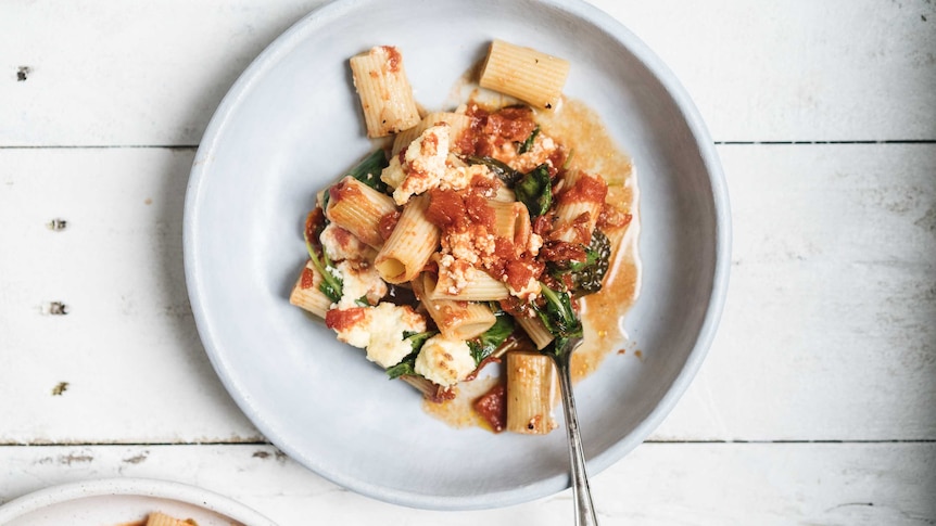 Serving of Hetty McKinnon's pasta bake with spinach, ricotta and tomato sauce recipe