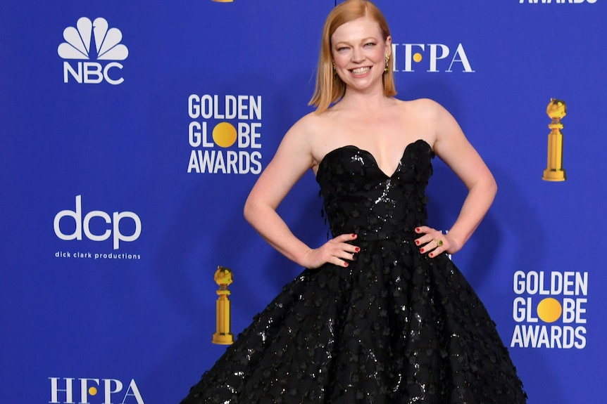 Sarah Snook in a long black dress