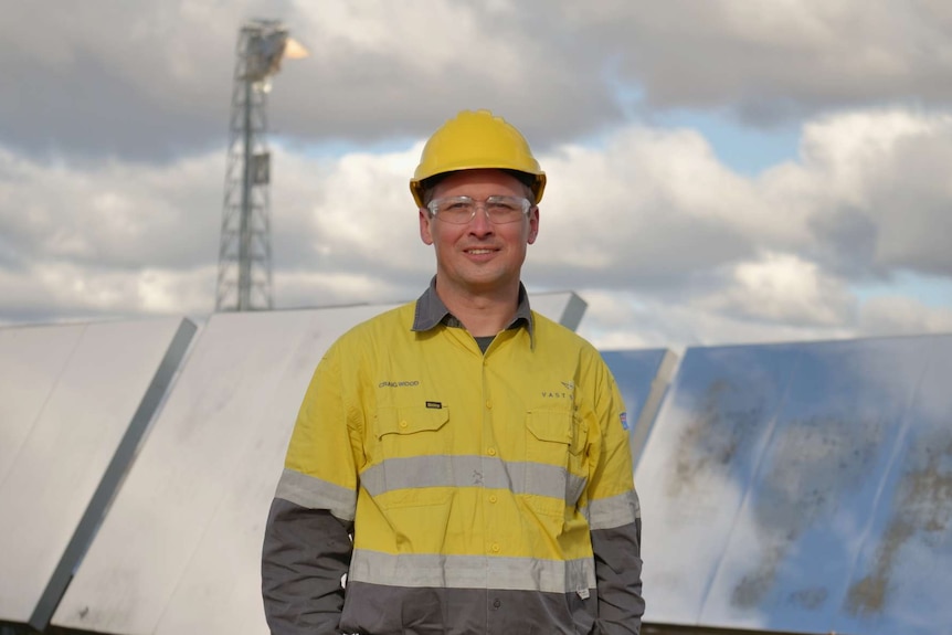 Vast Solar CEO Craig Wood stands in front of solar mirrors