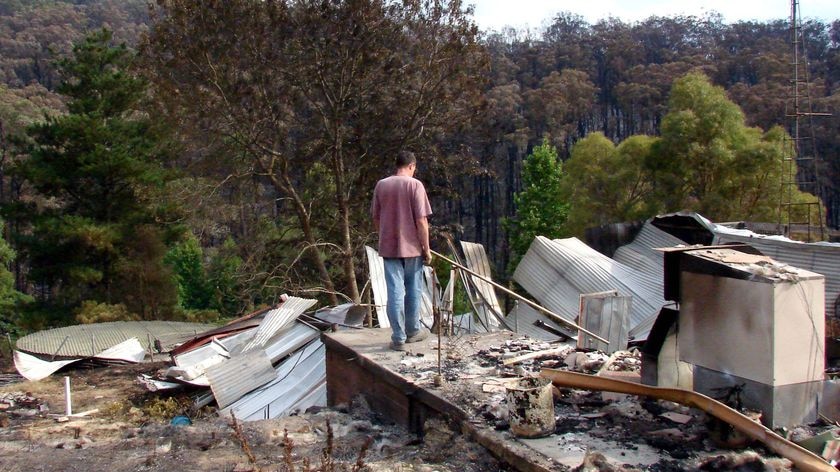 Robert Bruton looks over what used to be his house