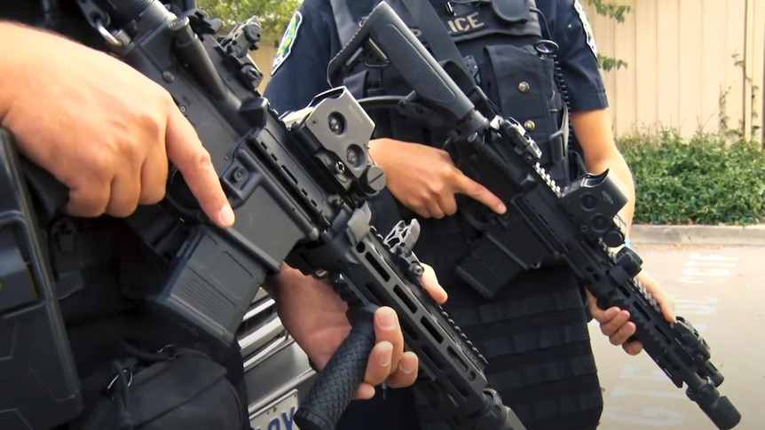 Unidentified SA Police officers hold guns.