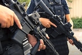 Unidentified SA Police officers hold guns.