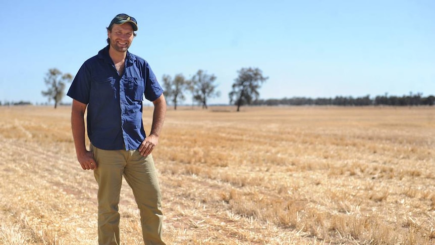 President of the Victorian Farmers Federation David Jochinke standing in front of a harvested paddock.