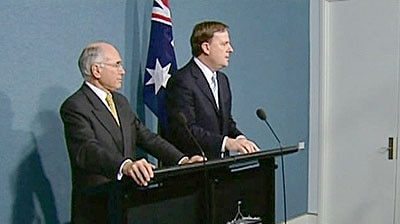 John Howard says he has no doubt Mr Costello will work hard for coalition re-election. (File photo)