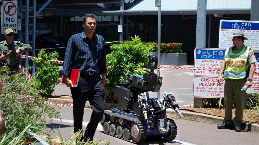 The bomb squad robot arrives at the scene of an explosion at the Woolworths complex