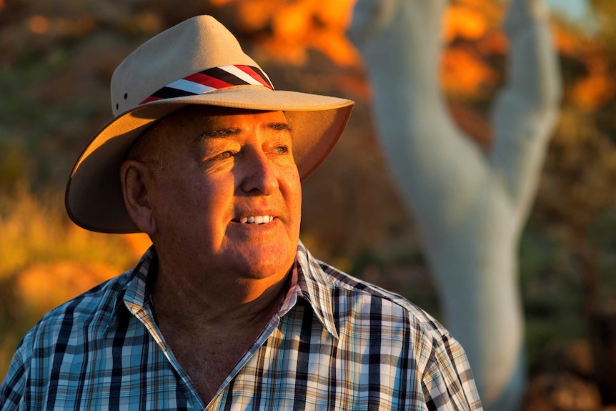 Ted Egan looks into the golden light of sunset.