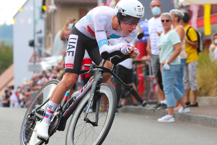 A person on a bicycle in lycra rides in the tour de france.