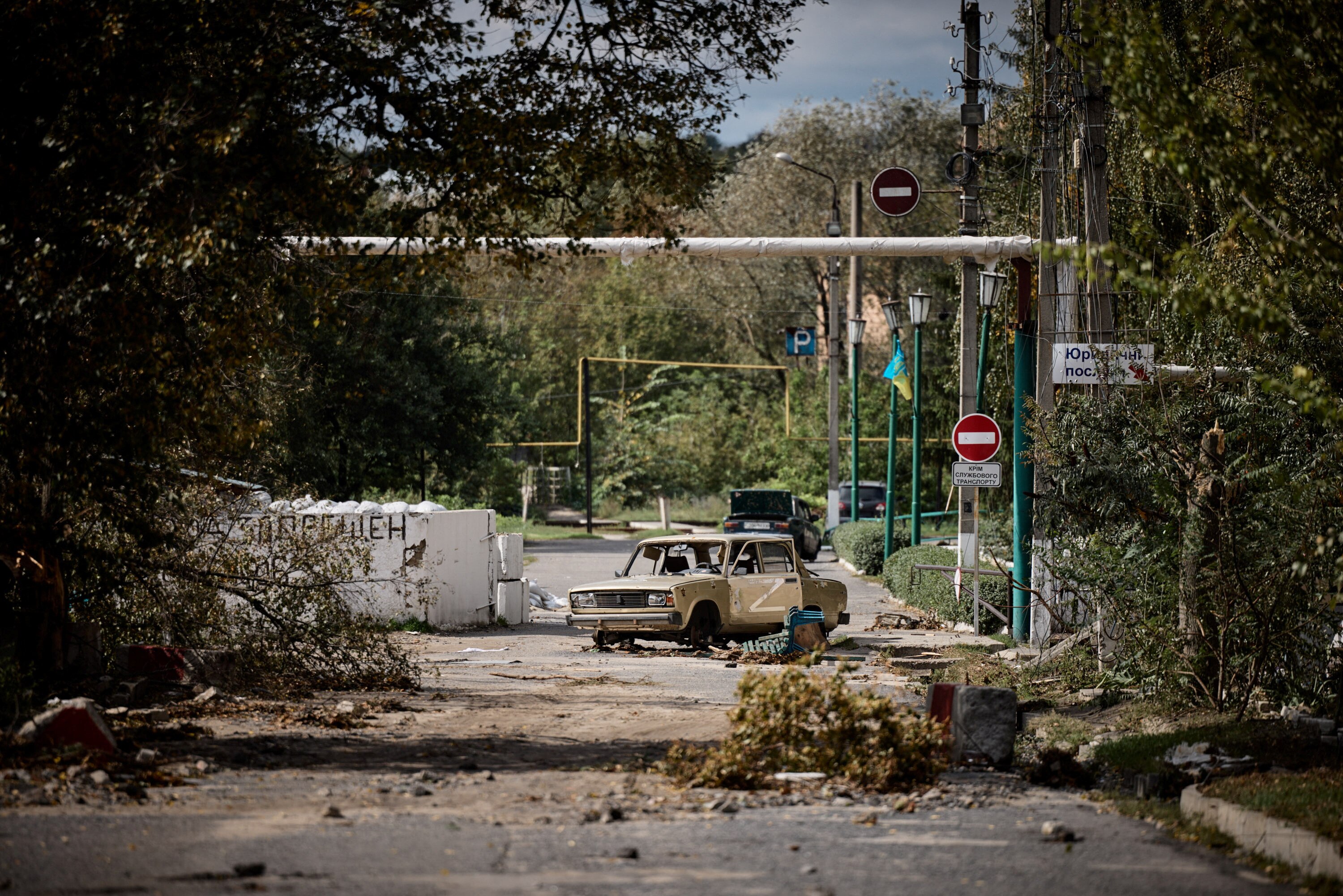 A damaged car with a letter 'Z' in seen in the town of Kupiansk.