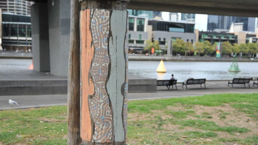 Aboriginal art on a recycled pier pole in along the Yarra River in Melbourne.