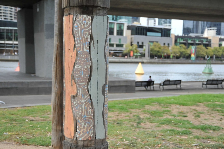 Aboriginal art on a recycled pier pole in along the Yarra River in Melbourne.