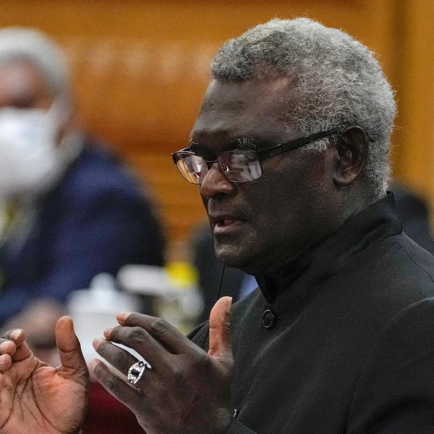 Solomon Islands Prime Minister Manasseh Sogavare speaking at a meeting.