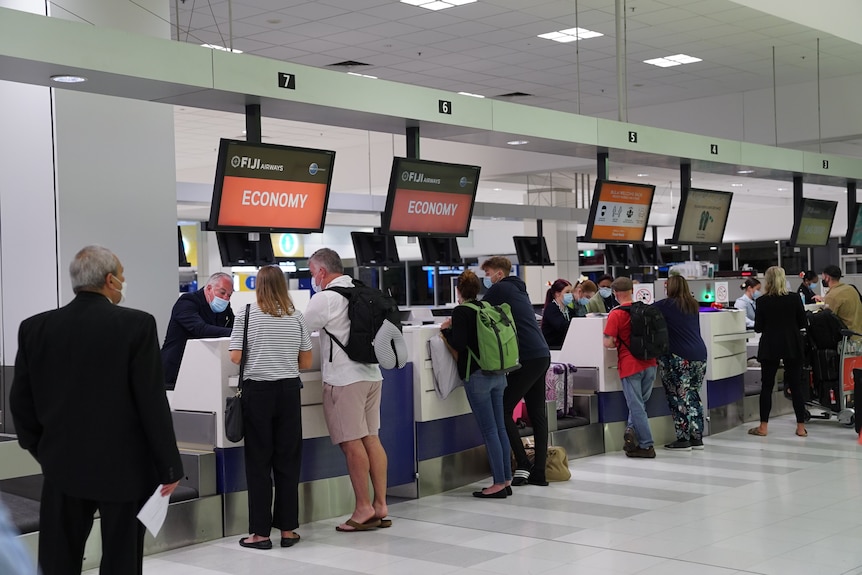 People at airport travel check in counters